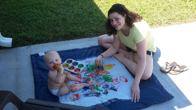 Finger painting with colored rice cereal 